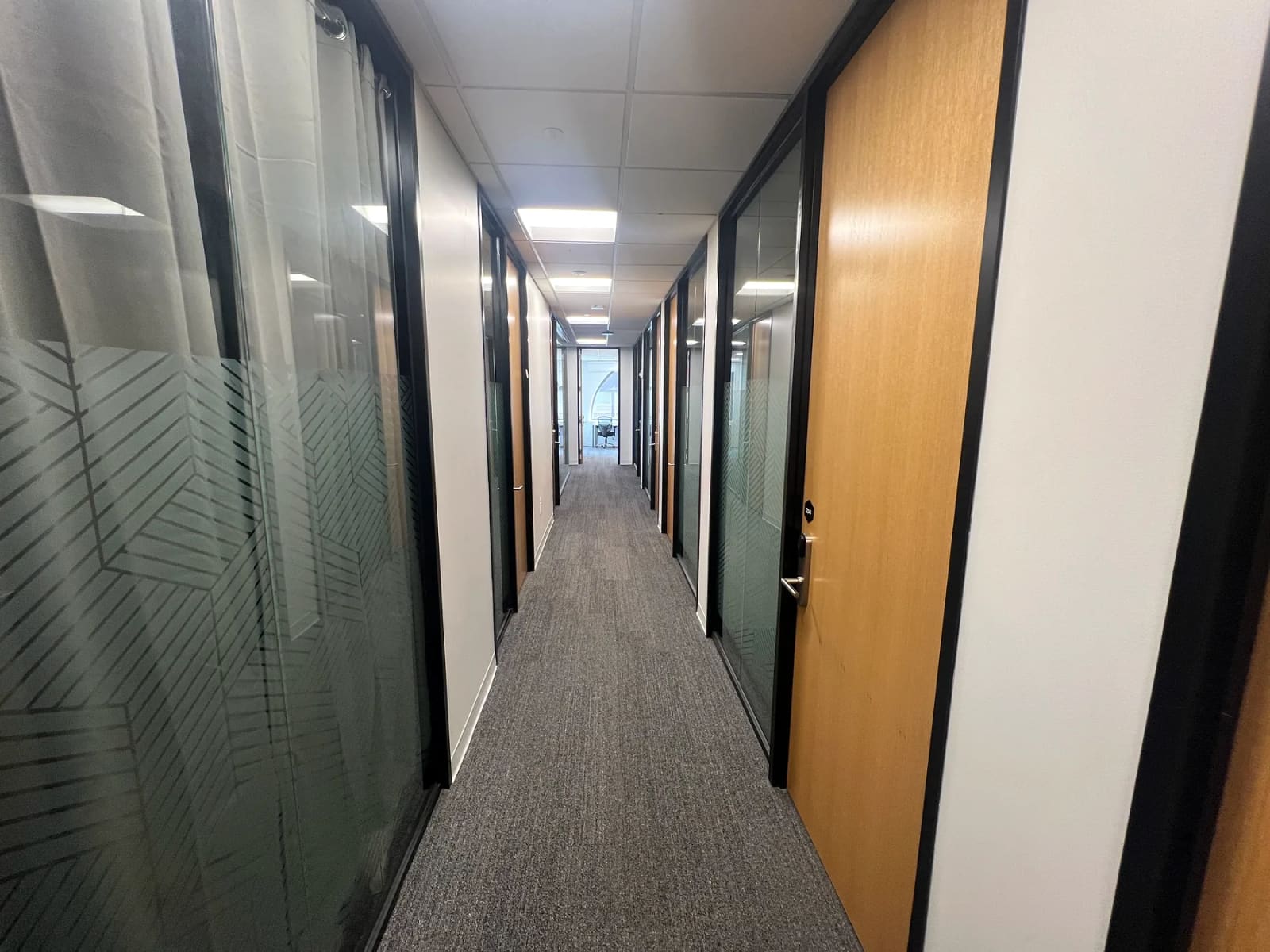 Hallway with glass office partitions at 41 Flatbush Avenue in Downtown Brooklyn.